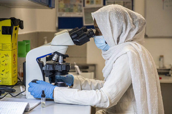 Lab technician analysing samples in the Nyala Paediatric Centre, Sudan.